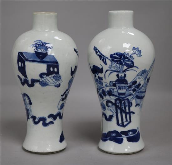 A pair of Chinese blue and white vases, wood stands